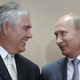 Russian Prime Minister Vladimir Putin, right, and Rex Tillerson, ExxonMobil's chief executive smile during a signing ceremony in the Black Sea resort of Sochi, Russia, Tuesday, Aug. 30, 2011. Russia's state-owned Rosneft teamed up with U.S. company ExxonMobil on Tuesday to develop huge offshore oil fields in the Russian Arctic in return for access to resources in the Gulf of Mexico.